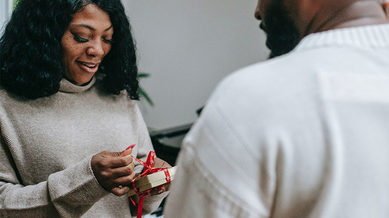 woman receiving gift from a man