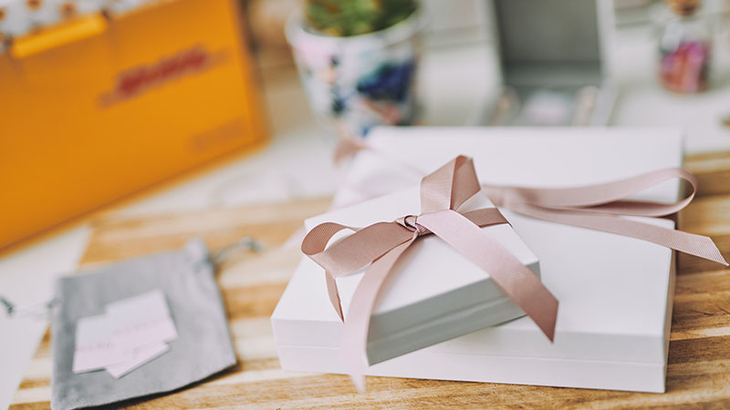 white presents with pink ribbons