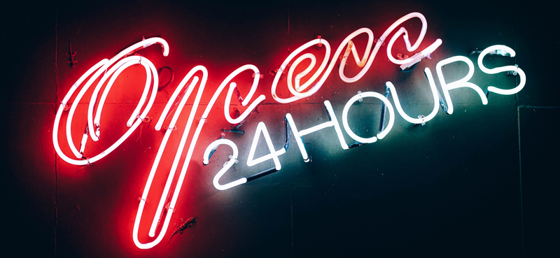 Neon sign reading 'open 24 hours'