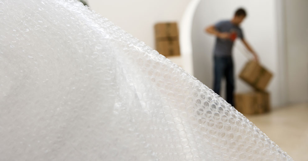 Bubble wrap with man unpacking