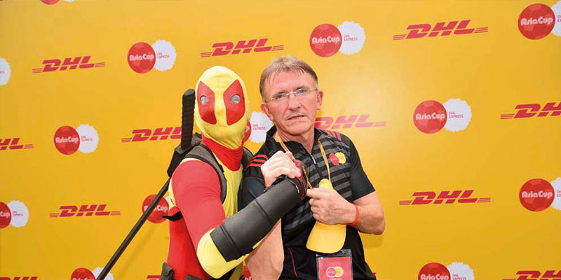Ken Allen and a superhero dressed in DHL colours