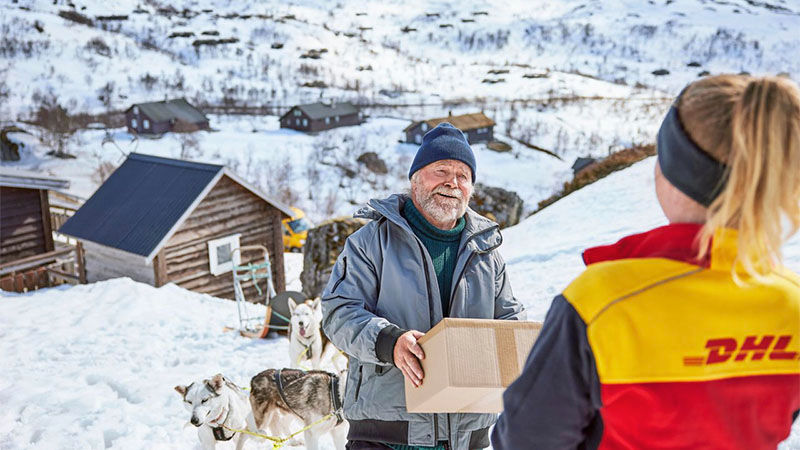 man receiving parcel from DHL courier