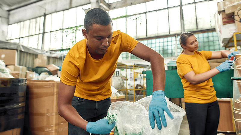 man and woman packing items for shipping