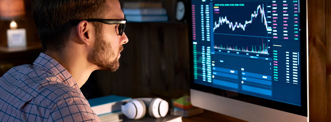 image of person staring into a screen deep in thought/strategising