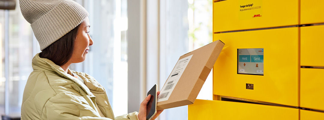 woman returning parcel in parcel locker