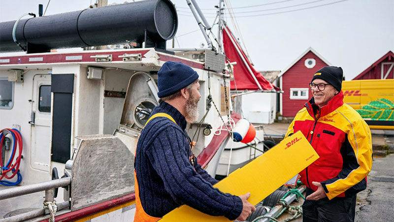 man accepting package from DHL courier