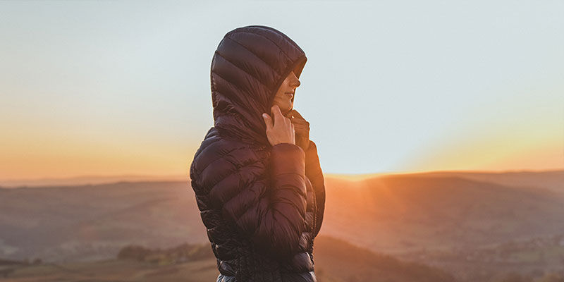 Woman in dark peak jacket 