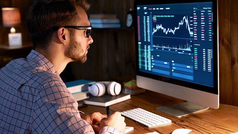 man looking at pc screen