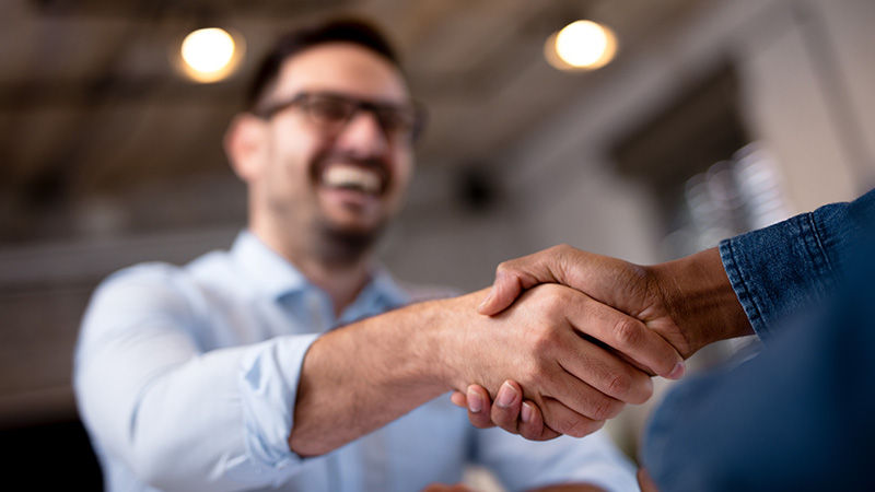 two people shaking hands