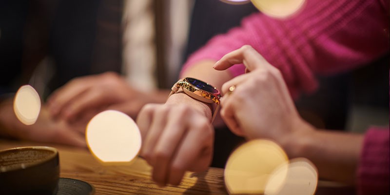 Woman tapping her Mobvoi watch