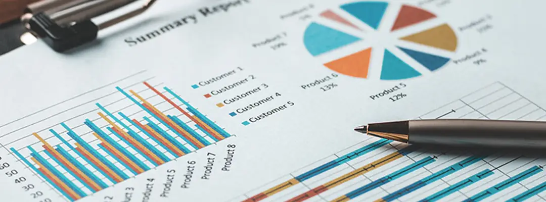 clipboard with paper showing diagrams and statistics