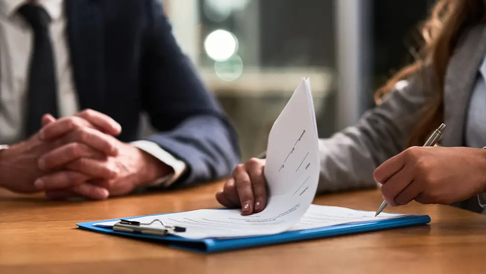 woman signing document