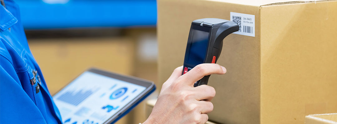 man scanning barcode on parcel