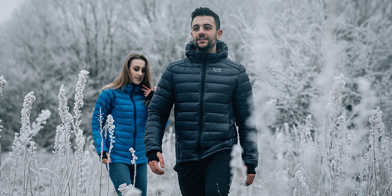 Man and woman in dark peak jackets