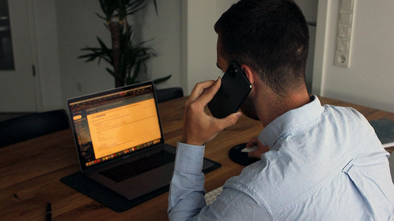 man looking at laptop screen