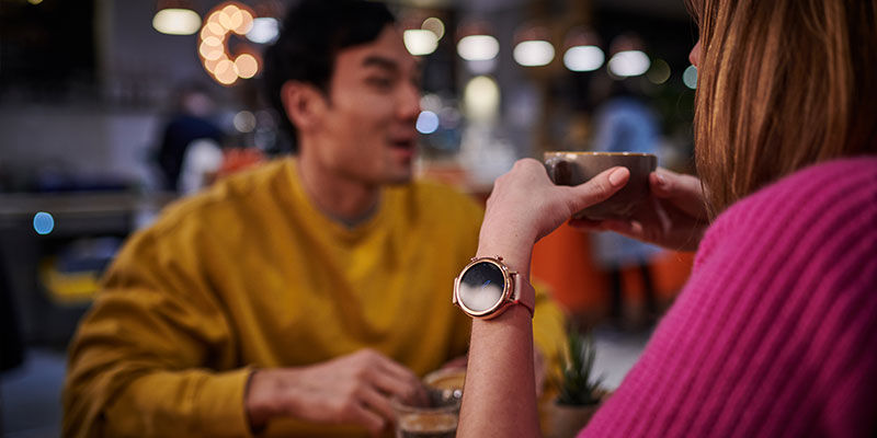 Woman with Mobvoi watch holding mug  