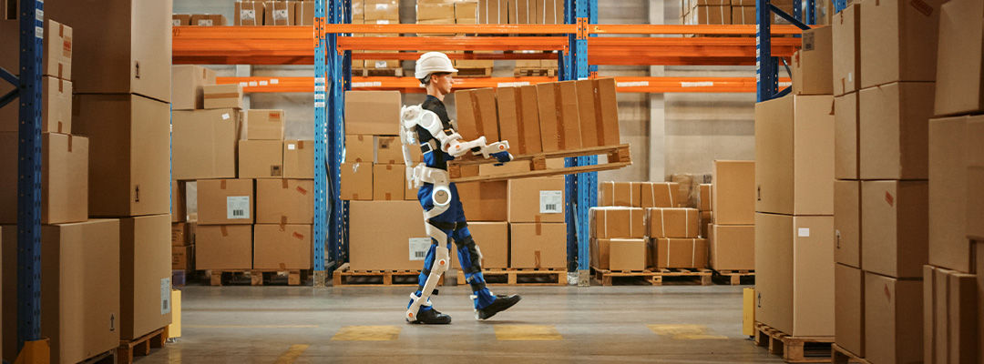 man in warehouse wearing robot