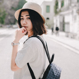 Young woman walking down a street