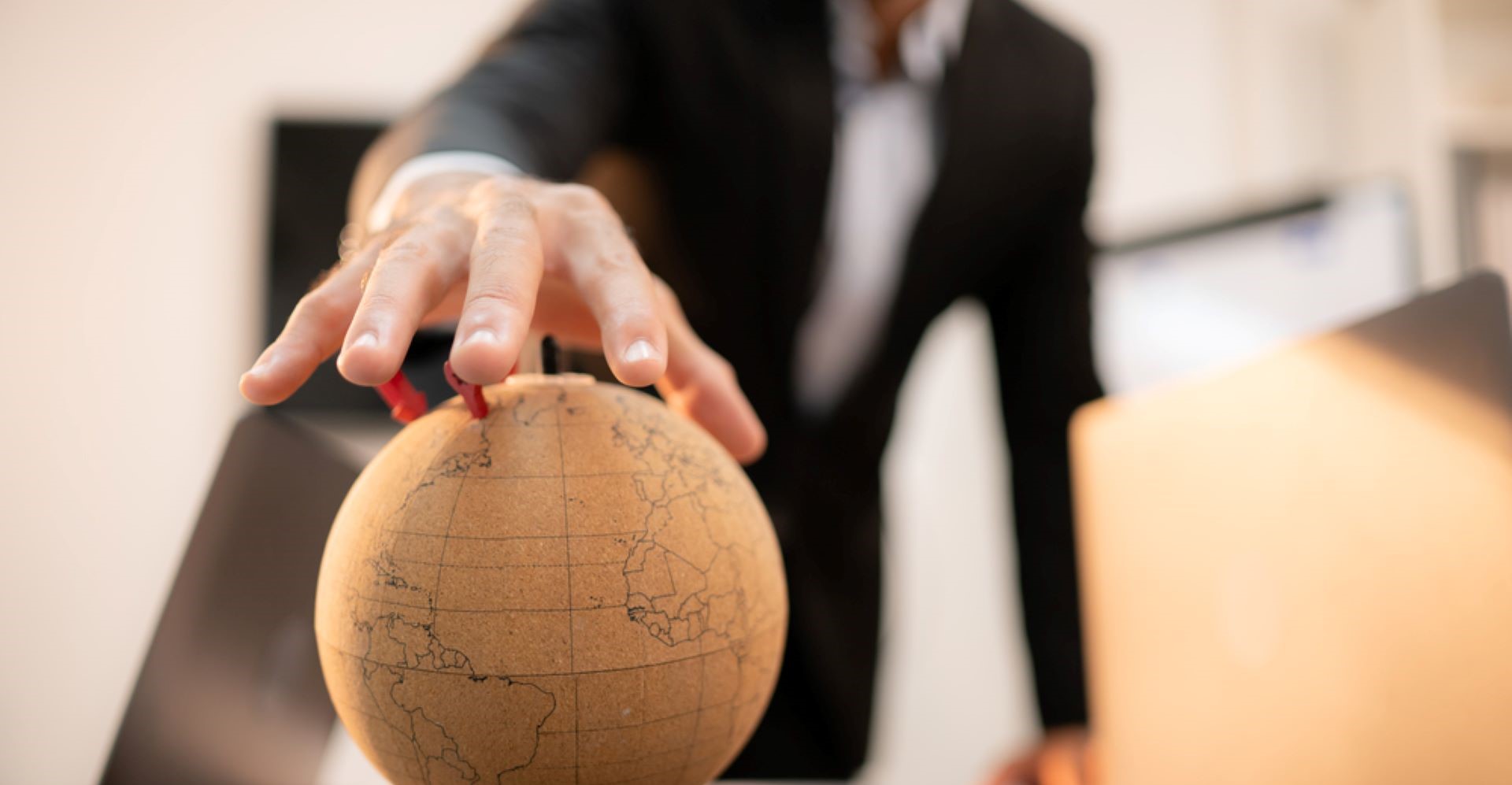 A man holding a globe