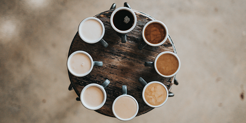8 coffee cups on a table