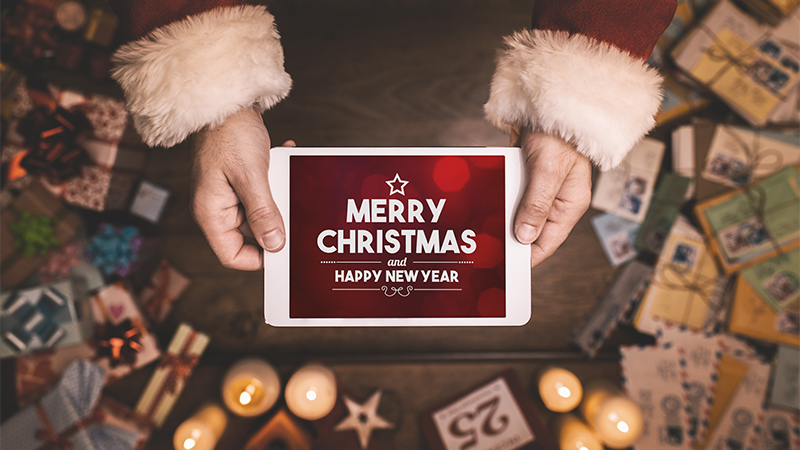 tablet screen with merry Christmas written on it
