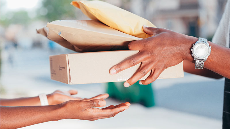 two hands exchanging parcels