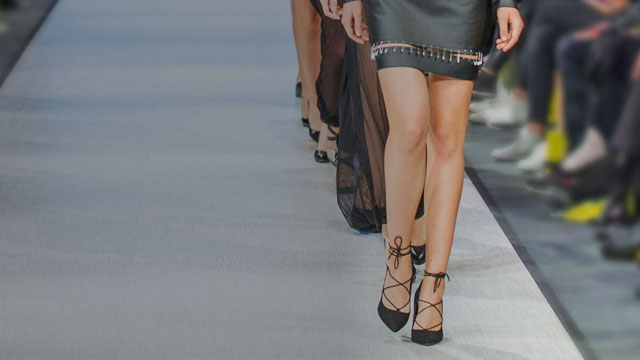 models' legs on a runway