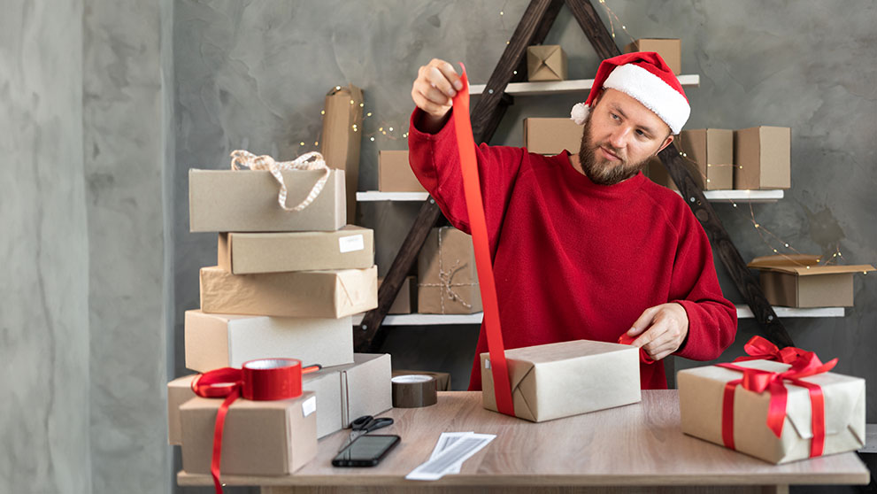 man wrapping parcel