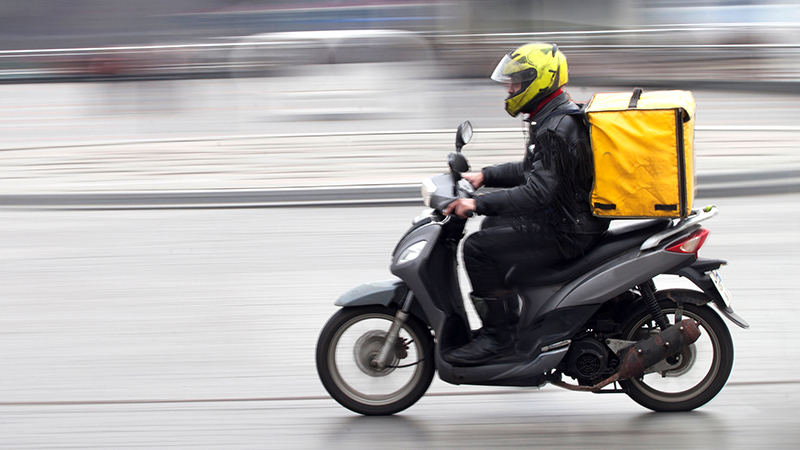 delivery man on motorbike