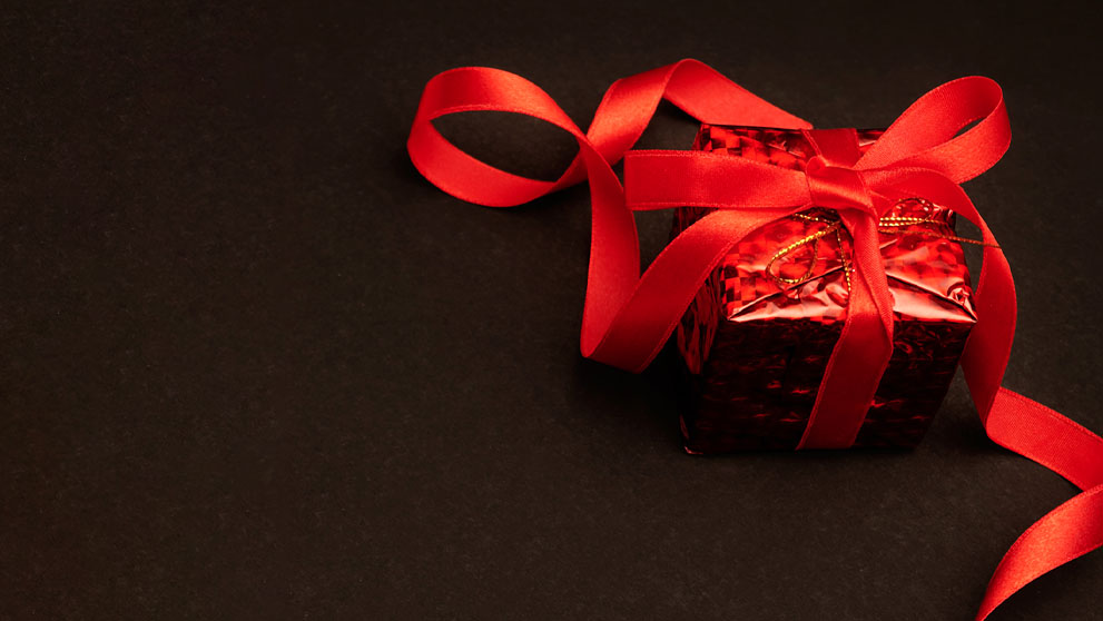 red present on a black background