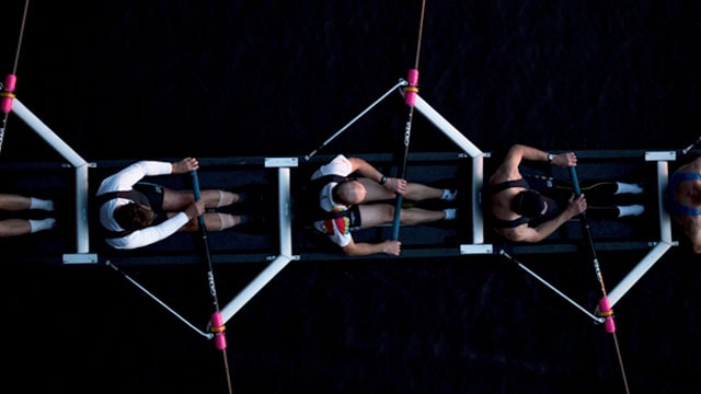 Birds eye view of men rowing in a rowing boat