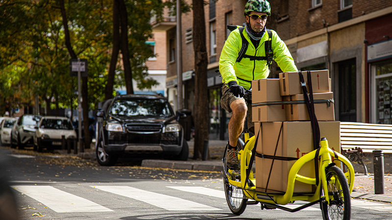 man riding delivery bike
