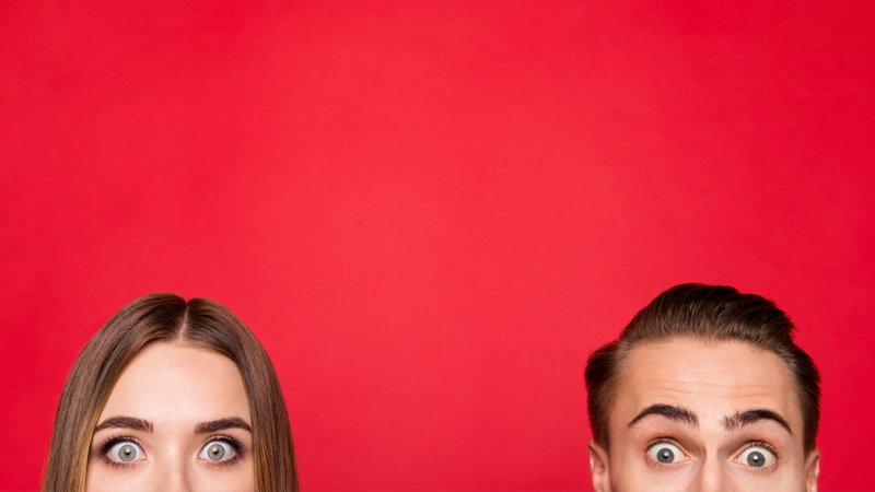 two heads on a red background