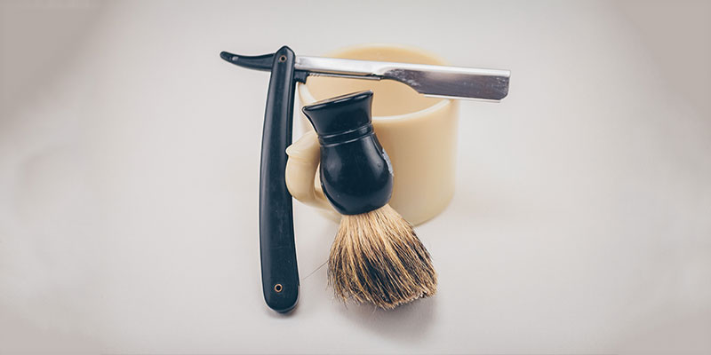 Mug with shaving knife and brush