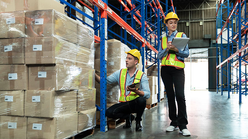 man and woman in warehouse