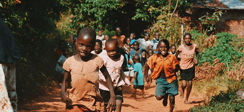 Children running on a South African street