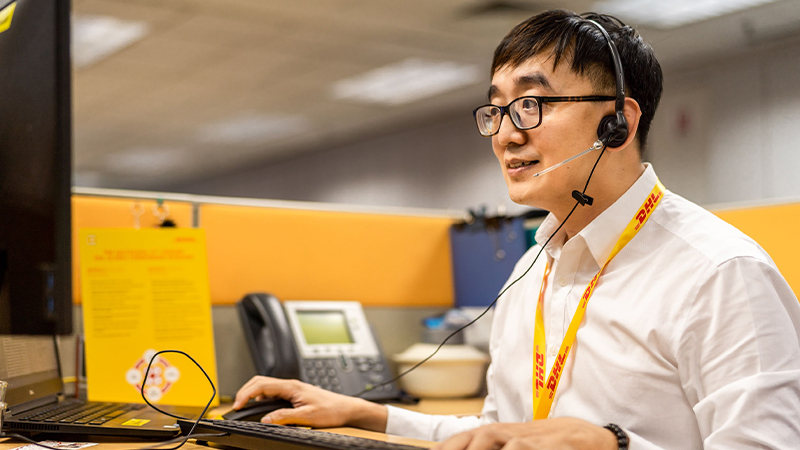DHL employee handling calls