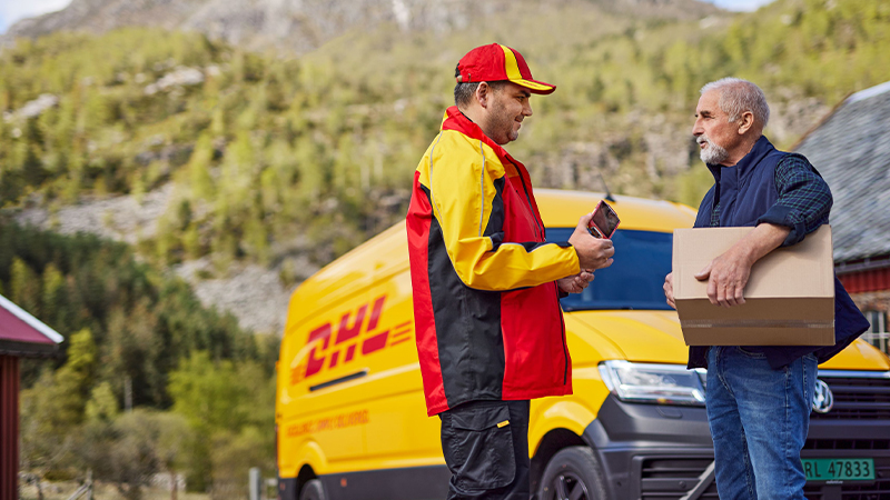 DHL courier handing a man a parcel