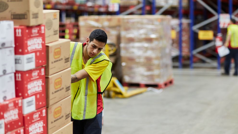 dhl express employee moving packaging for transport