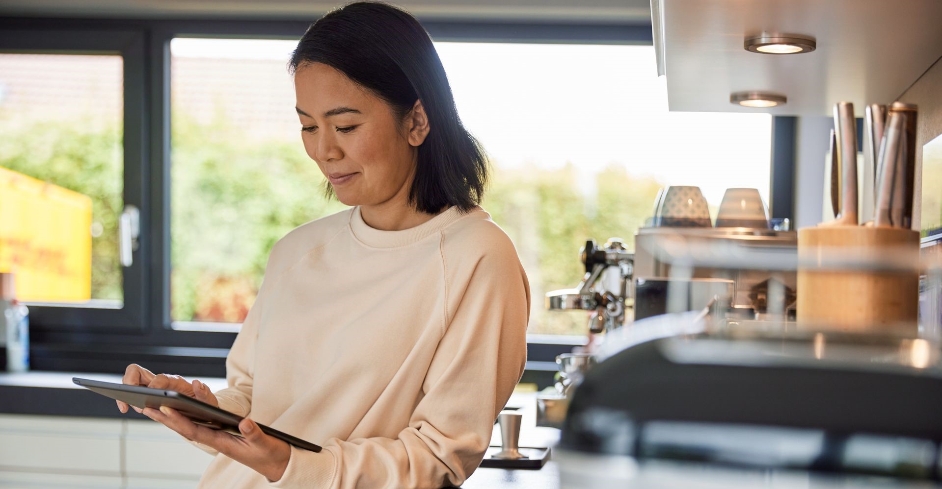 a female business owner using a tablet to estimate shipping costs