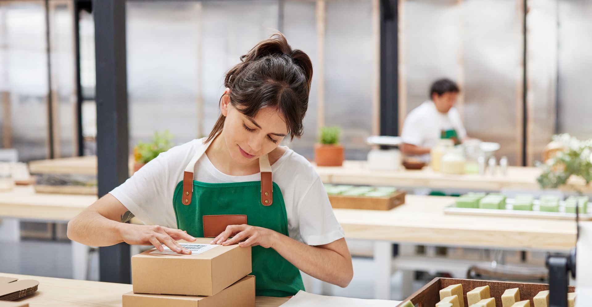 A lady preparing an order for her e-commerce business.